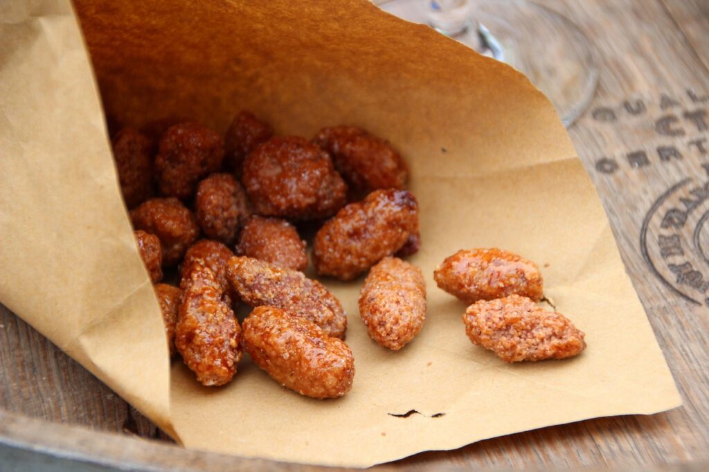 Roasted sugared almonds in a paper bag