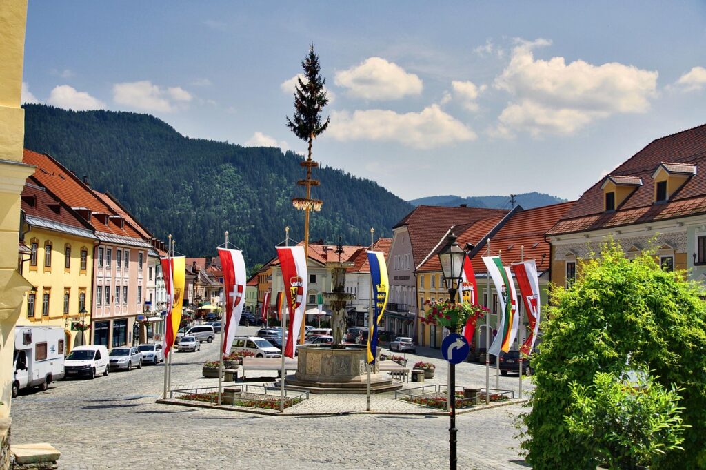 A decorated Maibaum in a Bavarian village square