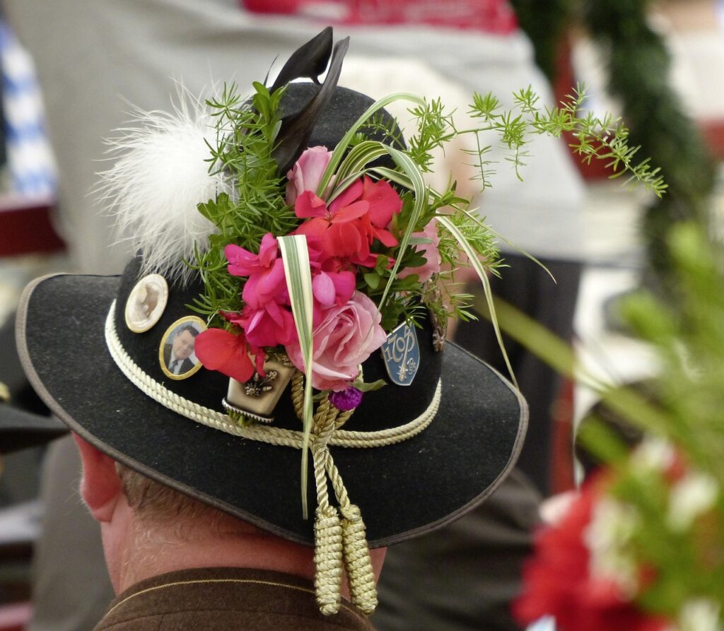 A Bavarian hat and a Maß of beer on a beer garden table