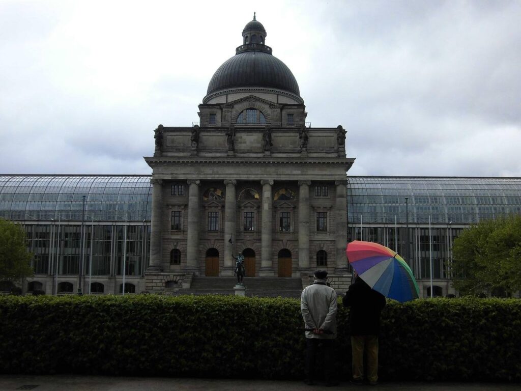 People under umbrellas in the rain in Munich